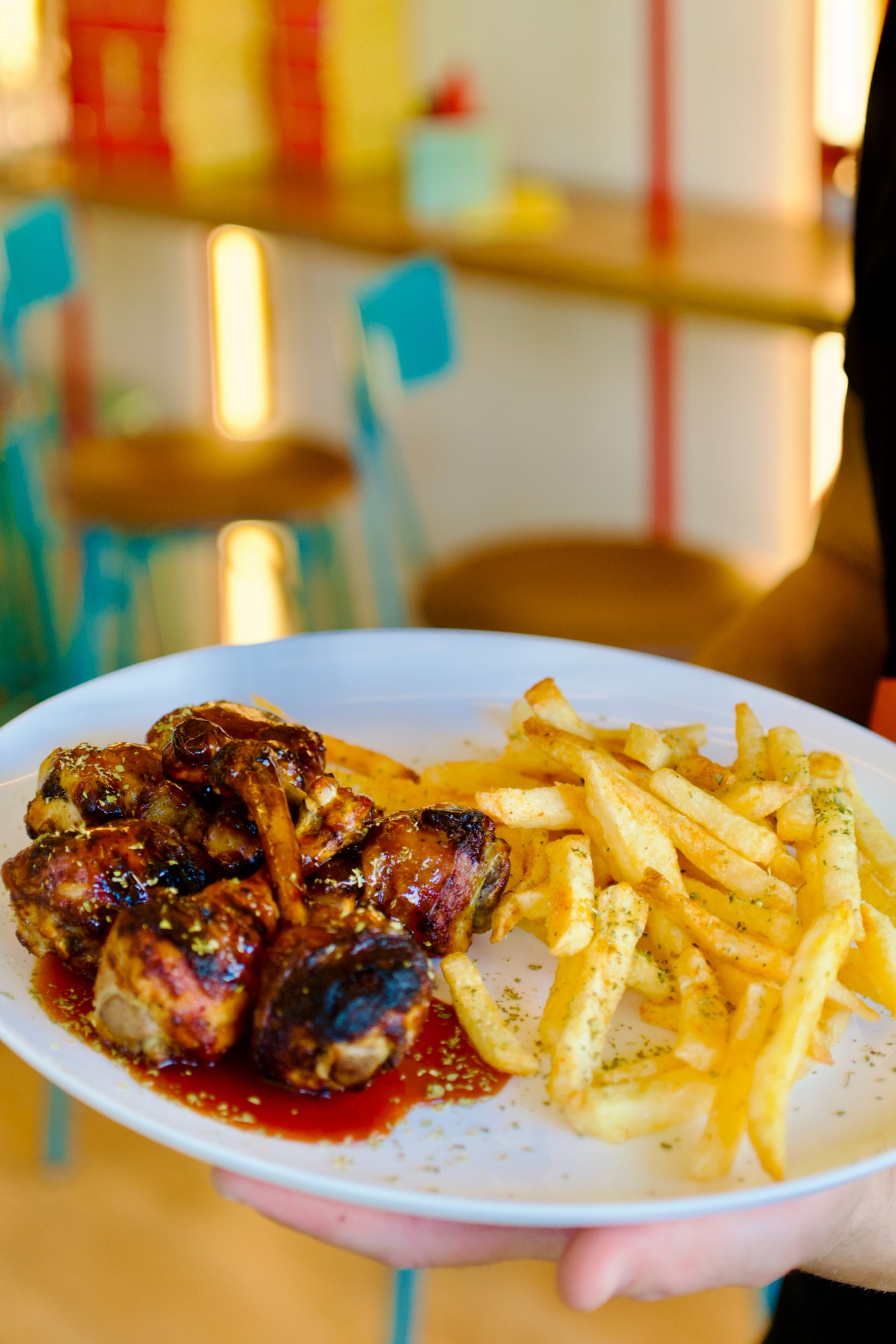 Glazed chicken wings and fries at Kokoloko's, Melissia